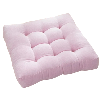 Pink cushion with a white background